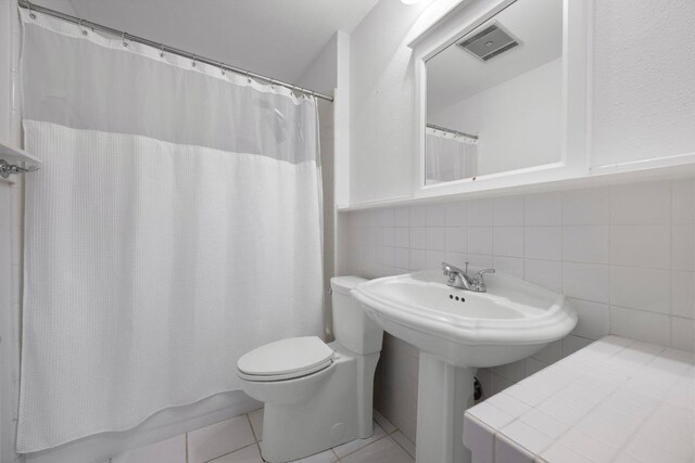 8006 Red Willow Dr, Austin, TX 78736 - bathroom featuring tile patterned floors and tile walls
