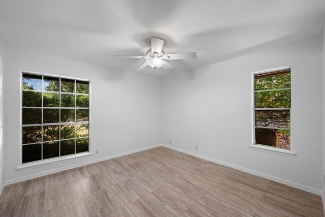 8006 Red Willow Dr, Austin, TX 78736 - unfurnished room featuring a ceiling fan and wood finished floors