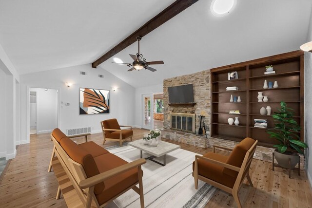 8006 Red Willow Dr, Austin, TX 78736 - living room featuring light wood-style floors, ceiling fan, a fireplace, and built in features