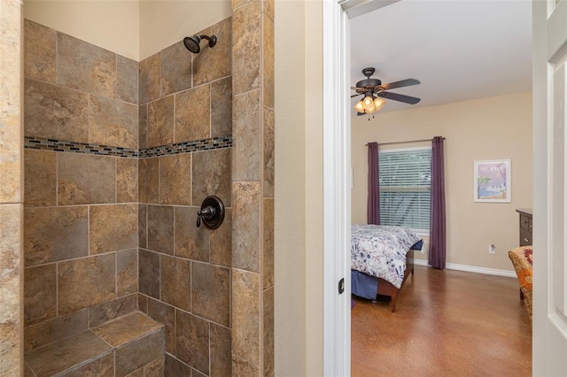 17219 Oak Cliff Cir, Dripping Springs, TX 78620 - ensuite bathroom with tiled shower, concrete flooring, a ceiling fan, and baseboards