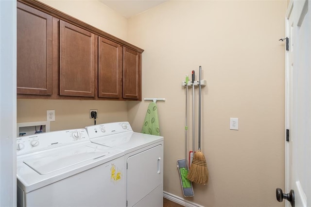 17219 Oak Cliff Cir, Dripping Springs, TX 78620 - washroom with cabinet space, washer and clothes dryer, and baseboards