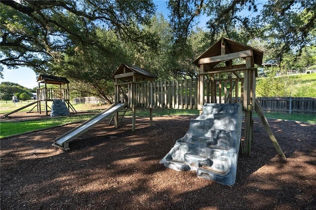 17219 Oak Cliff Cir, Dripping Springs, TX 78620 - community jungle gym featuring fence