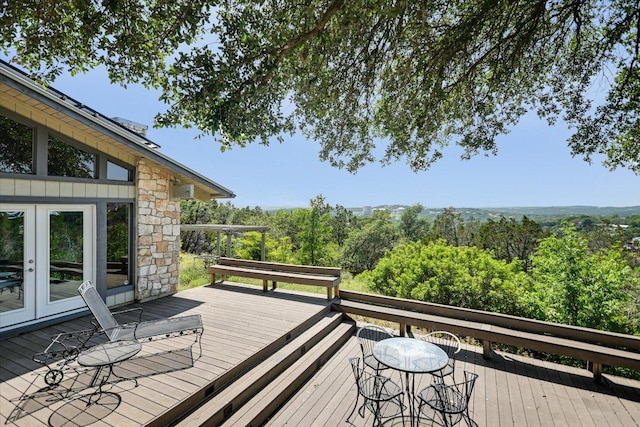 1004 Castle Ridge Rd, Austin, TX 78746 - wooden deck with french doors and a wooded view