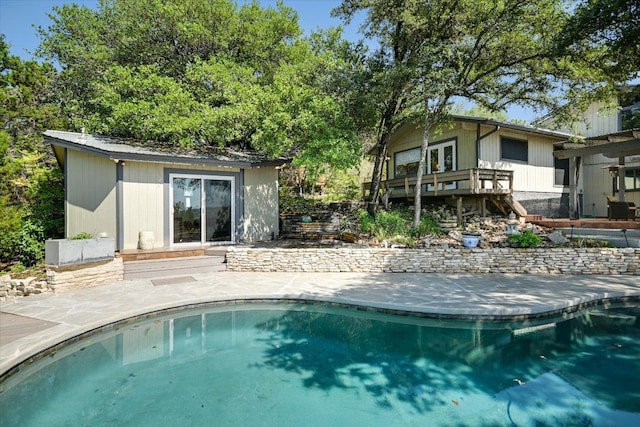 1004 Castle Ridge Rd, Austin, TX 78746 - outdoor pool with an outbuilding, stairway, a patio area, and a wooden deck