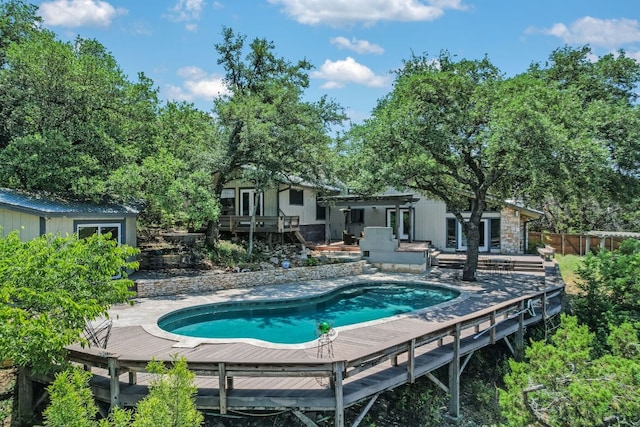 1004 Castle Ridge Rd, Austin, TX 78746 - swimming pool with a wooden deck, fence, and a pergola