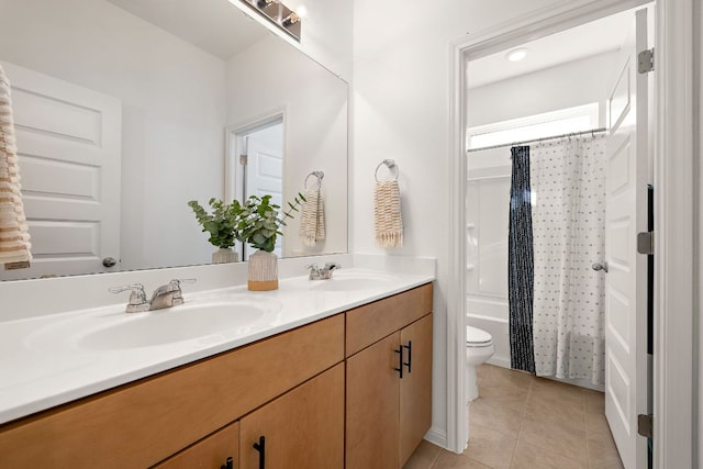 full bath featuring toilet, tile patterned floors, double vanity, and shower / tub combo with curtain