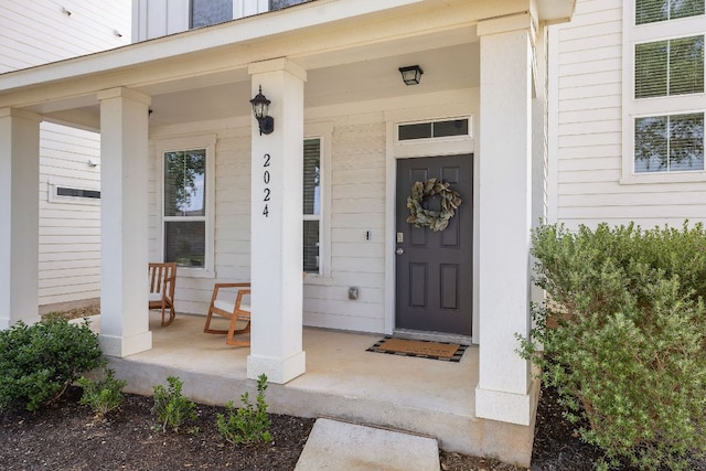 entrance to property with covered porch