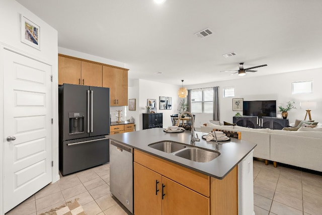 kitchen featuring black refrigerator with ice dispenser, dishwasher, a sink, light tile patterned floors, and a ceiling fan