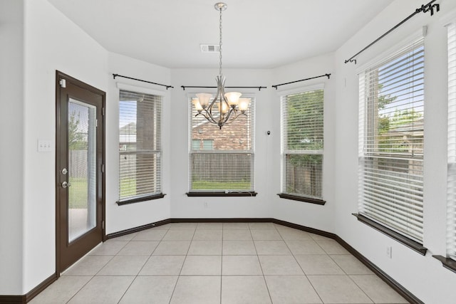 221 Mandana St, Leander, TX 78641 - unfurnished dining area with a chandelier and baseboards