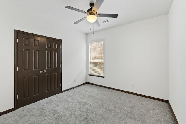 221 Mandana St, Leander, TX 78641 - unfurnished bedroom featuring carpet, a closet, and ceiling fan