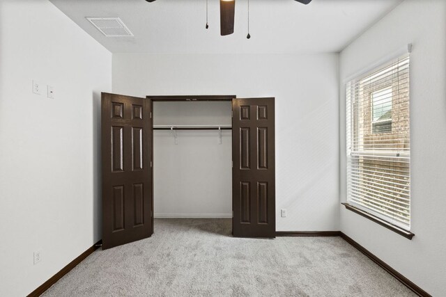 221 Mandana St, Leander, TX 78641 - unfurnished bedroom with carpet flooring, a closet, and a ceiling fan