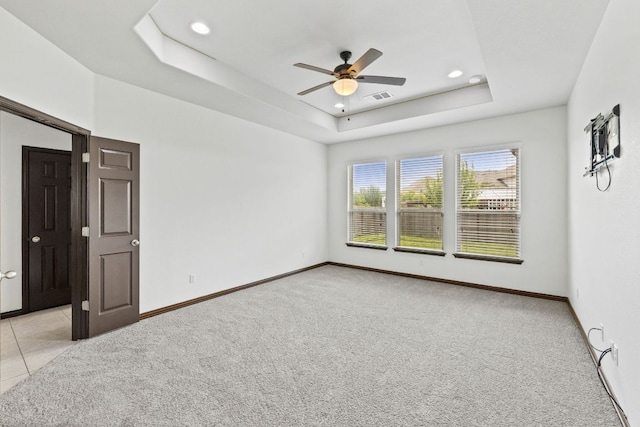 221 Mandana St, Leander, TX 78641 - unfurnished room featuring a raised ceiling, ceiling fan, light colored carpet, and recessed lighting