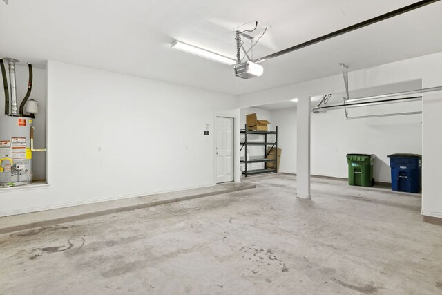 221 Mandana St, Leander, TX 78641 - garage with water heater and a garage door opener