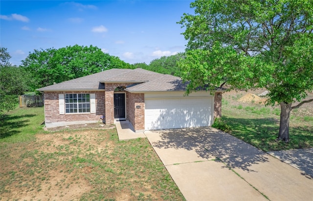 2312 Mac Arthur Ave, Lago Vista, TX 78645 - ranch-style house with brick siding, a garage, concrete driveway, and a shingled roof