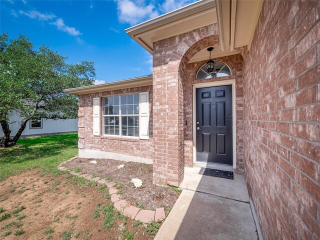 2312 Mac Arthur Ave, Lago Vista, TX 78645 - property entrance featuring brick siding