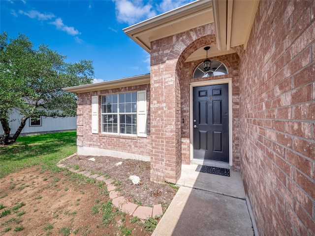 2312 Mac Arthur Ave, Lago Vista, TX 78645 - property entrance featuring brick siding