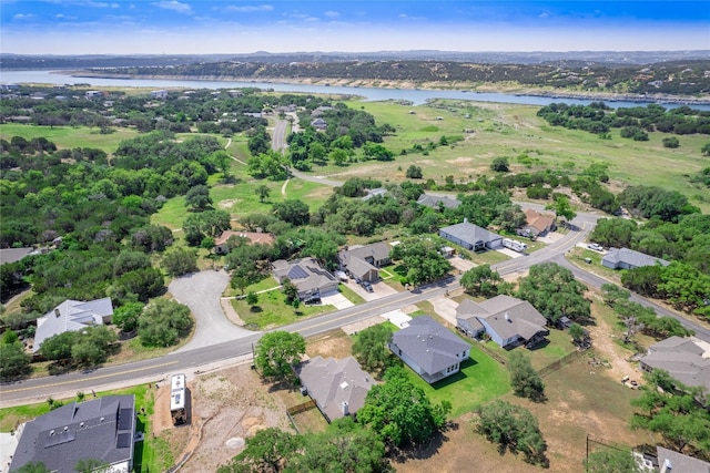 aerial view of residential area with a large body of water