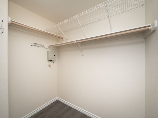 2312 Mac Arthur Ave, Lago Vista, TX 78645 - walk in closet with dark wood-style flooring