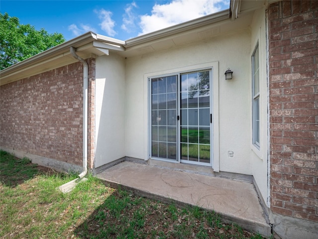 2312 Mac Arthur Ave, Lago Vista, TX 78645 - entrance to property featuring brick siding and stucco siding