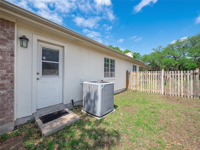doorway to property with central air condition unit