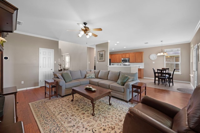 191 Fresno Spgs, Buda, TX 78610 - living area with ornamental molding, ceiling fan, light wood-style floors, baseboards, and recessed lighting