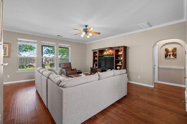 191 Fresno Spgs, Buda, TX 78610 - living room with a ceiling fan, dark wood-style floors, baseboards, crown molding, and arched walkways