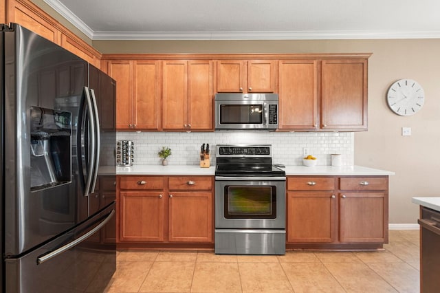 191 Fresno Spgs, Buda, TX 78610 - kitchen featuring appliances with stainless steel finishes, ornamental molding, light countertops, tasteful backsplash, and brown cabinets