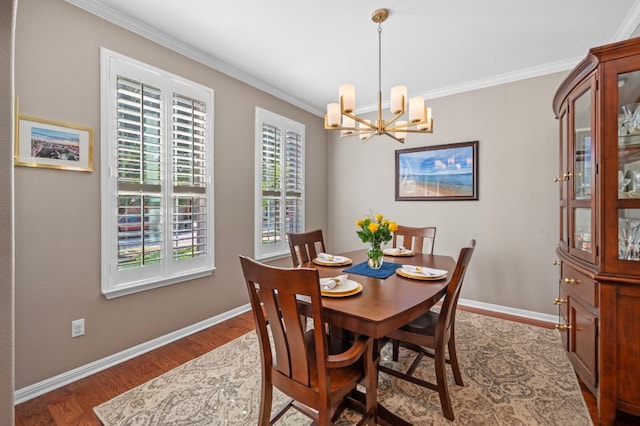 191 Fresno Spgs, Buda, TX 78610 - dining room featuring a chandelier, ornamental molding, wood finished floors, and baseboards