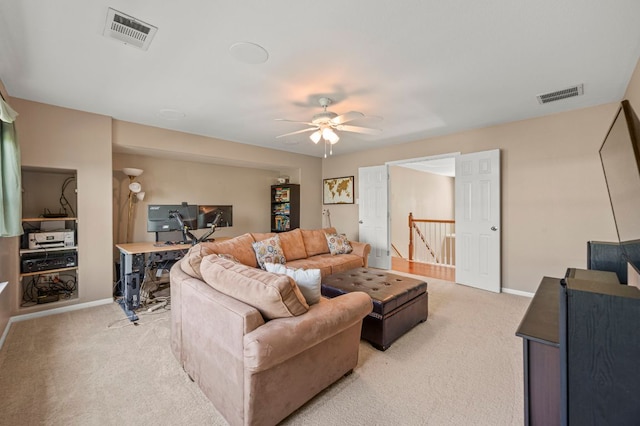 191 Fresno Spgs, Buda, TX 78610 - living area featuring light carpet, a ceiling fan, baseboards, and a desk