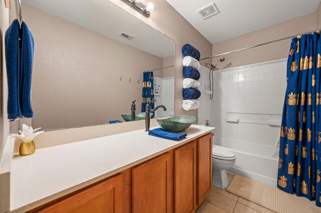 191 Fresno Spgs, Buda, TX 78610 - full bath featuring tile patterned floors, vanity, toilet, and shower / bath combo with shower curtain