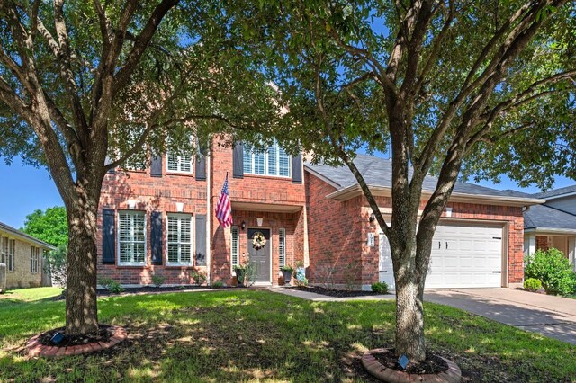 191 Fresno Spgs, Buda, TX 78610 - view of front of property featuring brick siding, concrete driveway, and an attached garage