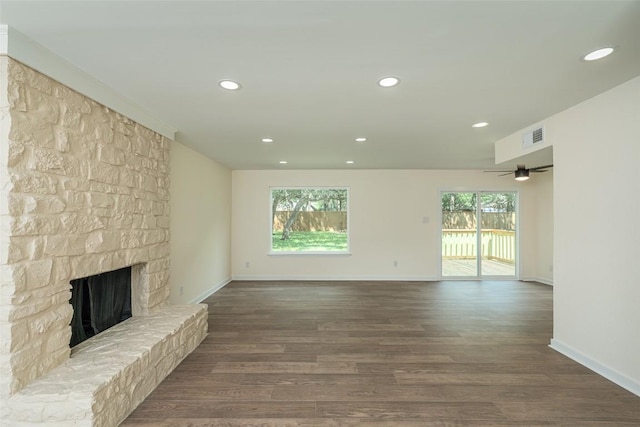 2105 Emerald Isle Dr, Leander, TX 78641 - unfurnished living room with a fireplace, wood finished floors, baseboards, and recessed lighting