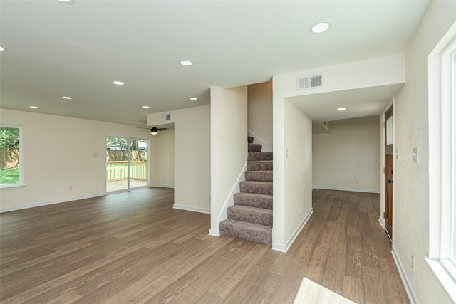 2105 Emerald Isle Dr, Leander, TX 78641 - staircase featuring wood finished floors, recessed lighting, ceiling fan, and baseboards