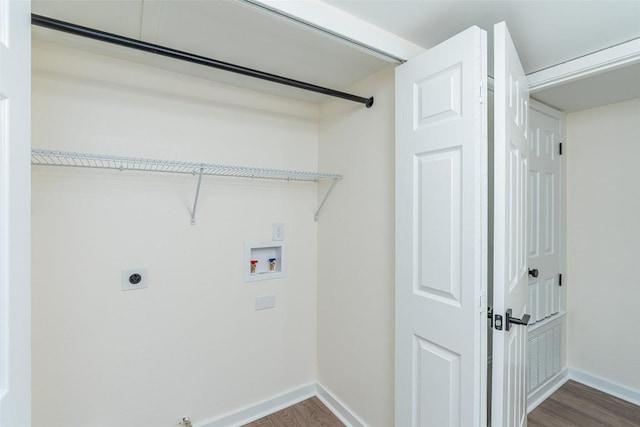 2105 Emerald Isle Dr, Leander, TX 78641 - laundry area featuring hookup for a washing machine, dark wood-style floors, hookup for an electric dryer, and baseboards