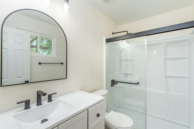 2105 Emerald Isle Dr, Leander, TX 78641 - bathroom with toilet, a stall shower, and vanity