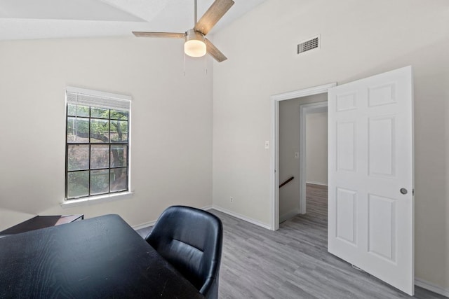 8805 Clearbrook Trl Unit A, Austin, TX 78729 - home office with wood finished floors, ceiling fan, and high vaulted ceiling