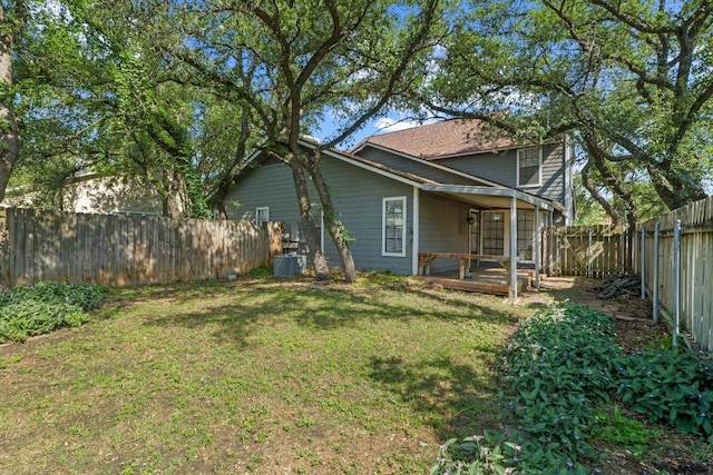 8805 Clearbrook Trl Unit A, Austin, TX 78729 - rear view of house featuring a fenced backyard and a deck