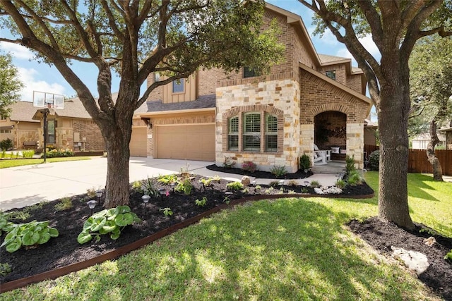 view of front of property with brick siding, a garage, stone siding, and concrete driveway
