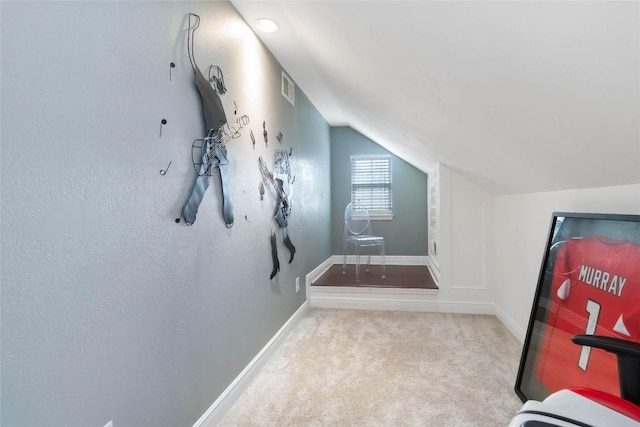 additional living space featuring lofted ceiling, carpet flooring, and baseboards