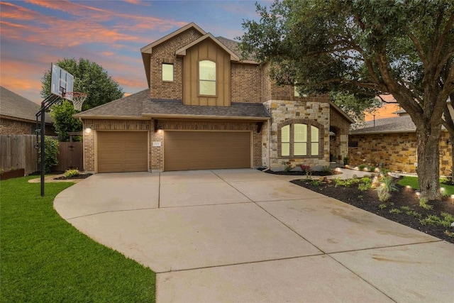 view of front facade with driveway, brick siding, a garage, a shingled roof, and board and batten siding