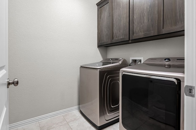 12709 Twisted Root Dr, Manchaca, TX 78652 - laundry area with separate washer and dryer, cabinet space, baseboards, and light tile patterned floors