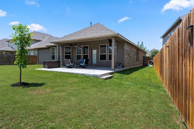12709 Twisted Root Dr, Manchaca, TX 78652 - rear view of house featuring a shingled roof and a patio area
