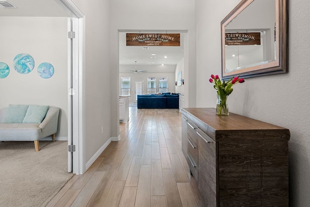 12709 Twisted Root Dr, Manchaca, TX 78652 - hall featuring light wood-style flooring and baseboards