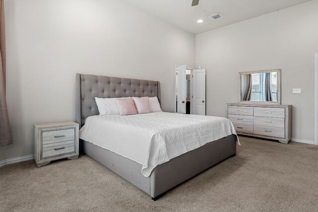 12709 Twisted Root Dr, Manchaca, TX 78652 - bedroom featuring light carpet, a high ceiling, baseboards, ceiling fan, and recessed lighting