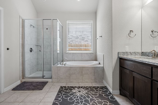 12709 Twisted Root Dr, Manchaca, TX 78652 - full bath featuring tile patterned floors, a stall shower, a bath, vanity, and baseboards