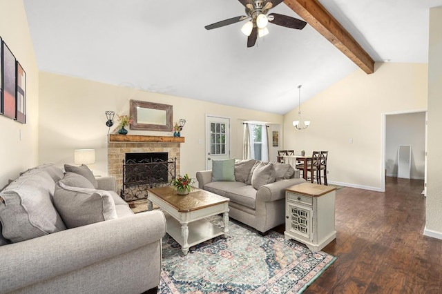 living room featuring a ceiling fan, dark wood-type flooring, a fireplace, baseboards, and a chandelier