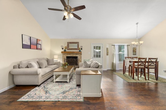 1403 Mills Meadow Dr, Round Rock, TX 78664 - living area with lofted ceiling, a brick fireplace, ceiling fan, wood finished floors, and a chandelier