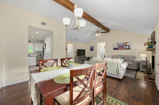 1403 Mills Meadow Dr, Round Rock, TX 78664 - dining room featuring dark wood-type flooring, a chandelier, a ceiling fan, and a fireplace