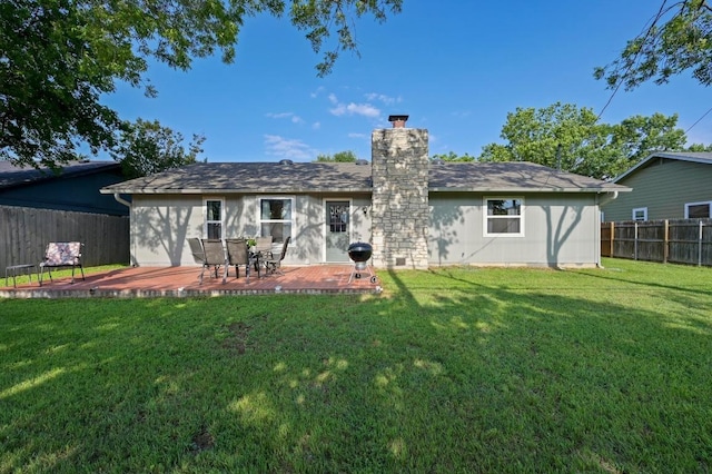 1403 Mills Meadow Dr, Round Rock, TX 78664 - rear view of house featuring a fenced backyard, a chimney, and a wooden deck