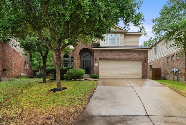 view of front facade with driveway, an attached garage, brick siding, and a front lawn